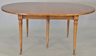 Louis XVI style fruitwood dining table with three 19 inch leaves. 47" x 67", opens to 124 inches   Provenance: The Estate of 