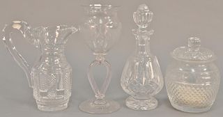 Four crystal pieces to include Waterford decanter, cut crystal pitcher, sugar bowl (ht. 9in.), and an etched glass vase on re