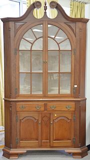 Mahogany centennial two part corner cupboard with shell carved top. ht. 97 in., wd. 54 in., dp. 28 in.  Provenance: From the 