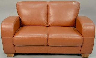 Brown leather loveseat. wd. 58 in.