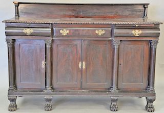 Empire style mahogany sideboard with paw feet (chip in top). ht. 48 in., wd. 68 in.  Provenance: From the Estate of Faith K. 