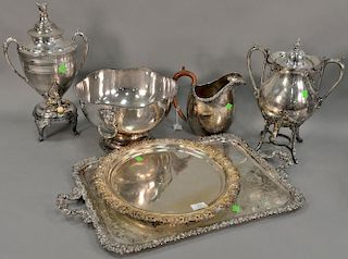 Six silver plated items to include large handled tray (16" x 27"), round tray, pitcher, two coffee pots with spigots, and a p
