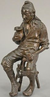 Bronze sculpture of an older man seated on a stool, unsigned. ht. 11in.