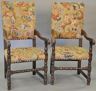 Pair of oak Jacobean style armchairs with needlepoint upholstery. ht. 47 in.  Provenance: From the Estate of Faith K. Tiberio