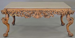 Hardwood Chinese table having granite top over carved apron and carved foo dog legs, ht. 28in., top: 31" x 58"  Provenance: F