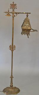 Iron floor lamp with mica shade. ht. 63 in.  Provenance: From the Estate of Faith K. Tiberio of Sherborn, Massachusetts