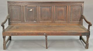 Jacobean oak bench with paneled back, late 17th to early 18th century. ht. 37 in., wd. 72 in.