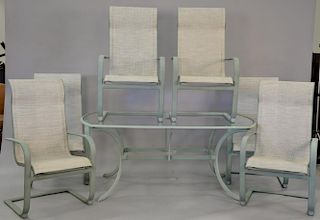 Outdoor seven piece patio set including six chairs and glass top table. ht. 28 in., top: 39" x 67"