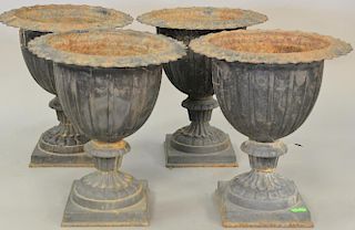Set of four Victorian iron urns. ht. 20 in., dia. 17 1/2 in.   Provenance: The Estate of Thomas F Hodgman of Fairfield, Conne