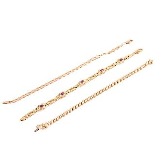 Three (3) Vintage 14 Karat Yellow Gold Link Bracelets, one with Oval Cabochon Rubies. Stamped 14K.