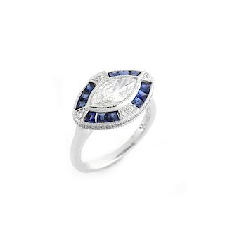 Art Deco style Approx. 1.05 Carat TW Diamond, .66 Carat Sapphire and Platinum Ring set in the Cente