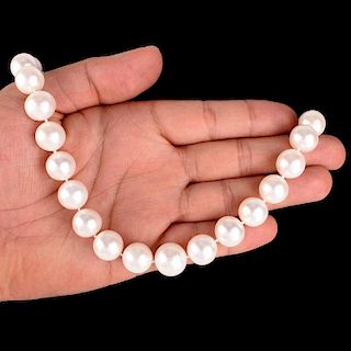 Single Strand Thirty Three (33) 13-15mm South Sea Pearl Necklace with 14 Karat Yellow Gold Clasp. P