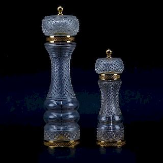 Two Baccarat Style Crystal And Brass Pepper Mills. Unsigned. Wear and in need of cleaning. Measures