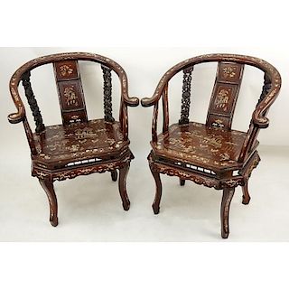 Pair of Chinese Carved Hardwood and Bone Inlay Horseshoe Armchairs. One chair has splits to armrest