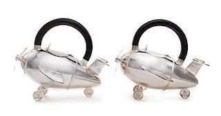 American, 20TH CENTURY, a pair of airplane form teapots