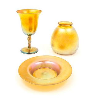Steuben, EARLY 20TH CENTURY, a group of three gold Aurene glass articles, comprising a goblet, dish and shade
