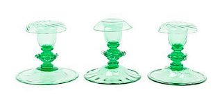 Steuben, 20TH CENTURY, three pomona green glass candlestick holders