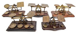 * A Group of Five Brass Postal Scales Width of largest 9 inches.