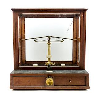 * An English Mahogany Cased Brass Assayer's Balance Height of case 19 3/4 x width 18 1/4 x depth 13 inches.