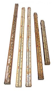 * A Group of Five Surveyor's Telescoping Level Rods Height of tallest 80 inches (when collapsed).