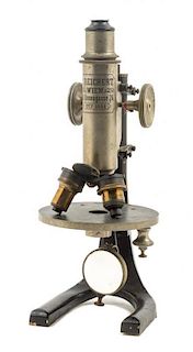 * An Austrian Nickel-Plated and Black Lacquered Microscope Height 10 inches.