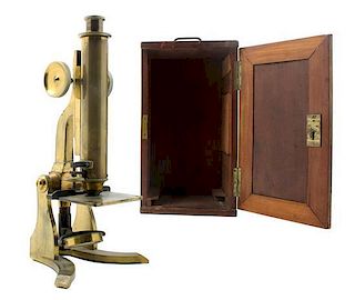 * An English Brass Microscope Height 12 1/2 inches.