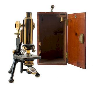 * An English Brass and Black Lacquered Microscope Height 12 1/2 inches.