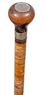 13. Stacked Washer Cane- Ca. 1920- A wooden handle with an inlaid silver dime atop, small silver metal collar, stacked washe
