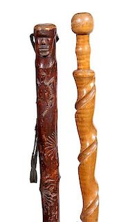 1. A Pair of Folk Art Canes-Early 20th Century-One has a carved head with a salamander and snake-elephant and the other is g