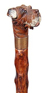 34. Dog Glove Holder Cane-  Ca. 1920- A carved and painted terrier with two color glass eyes, a button , underneath the low