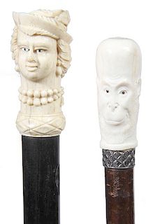 42. Portrait Bone Canes- Ca. 1880- A pair of bone dress canes both with inlaid eyes and one beinga classy lady and the other