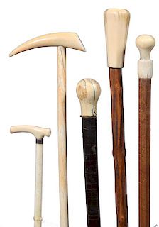 54. Nautical Canes- Ca. 1850-1890- A collection of whale’s tooth handles and two full shafts, whale bones of which all are