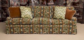 UPHOLSTERED THREE-SEAT FLORAL SKIRTED SOFA