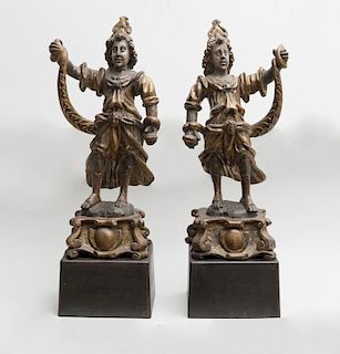 TWO CONTINENTAL CARVED GILTWOOD FIGURES OF SNAKE CHARMERS