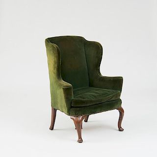 GEORGE I CARVED WALNUT WING ARMCHAIR