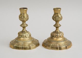 PAIR OF FLEMISH ENGRAVED BRASS CANDLESTICKS, IN THE RÉGENCE STYLE