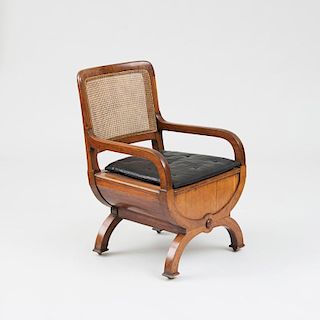 LATE REGENCY MAHOGANY AND CANED COMMODE CHAIR