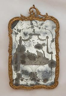 ITALIAN ROCOCO STYLE CARVED GILTWOOD, PAINTED AND INCISED GLASS MIRROR