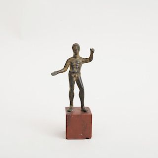 ETRUSCAN BRONZE FIGURE OF A YOUTH (PROBABLY HERADUS)