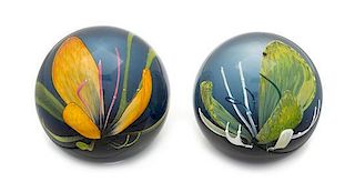 * Caithness Glass, Scotland, two glass paperweights, each with flower decoration
