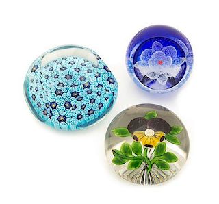 * A Group of Three Glass Paperweights, one marked for Caithness