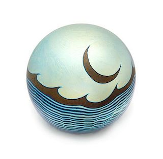 * Correia Art Glass, Fountain Valley, California, a moon and waves iridescent surface-design paperweight