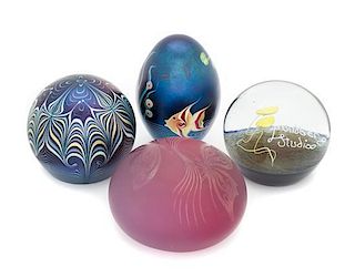 * Four Iridescent Glass Paperweights Diameter of largest 3 1/2 inches