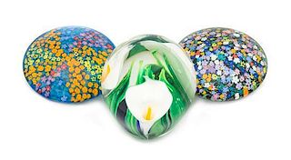 * Peter Raos, (American), three glass paperweights, each with floral decoration