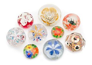 * A Collection of Glass Paperweights Diameter of largest 3 1/2 inches