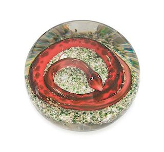 * Attributed to Baccarat, , a snake on rock ground paperweight