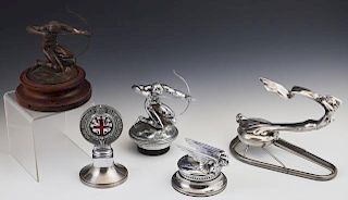 Group of Five Automotive Items, consisting of a 1929-31 Chevrolet chrome aviator hood ornament radiator cap, by Stant; an ena