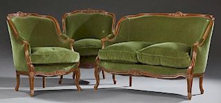 Three Piece French Louis XV Style Carved Beech Parlor Suite, 20th c., consisting of a settee and two bergeres, the arched she