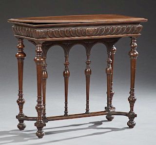 French Henri II Style Carved Walnut Games Table, c. 1880, the stepped top opening to an inset black baize playing surface ove