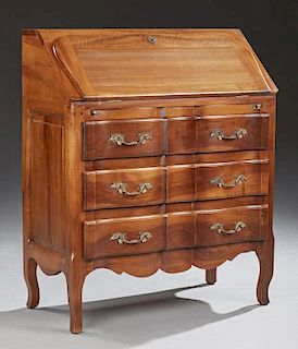French Louis XV Style Carved Cherry Slant Front Secretary, 20th c., the serpentine slant front opening to a gilt tooled green
